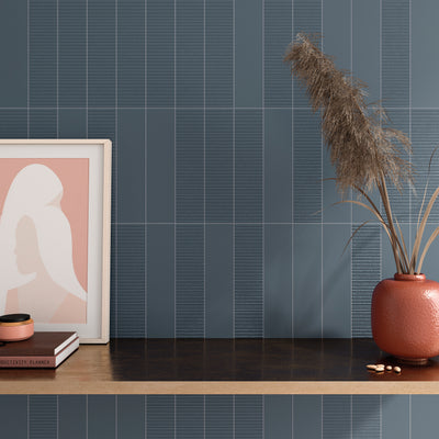 ElitTile Van subway tiles with blue-grey finish and alternating smooth and ribbed texture patterns on wall.