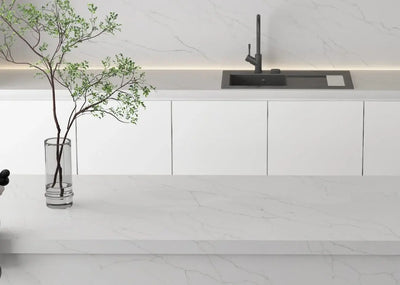 Modern minimalist kitchen featuring ElitTile quartz prefab countertops in white with grey veining, integrated backsplash and sink from premium collection