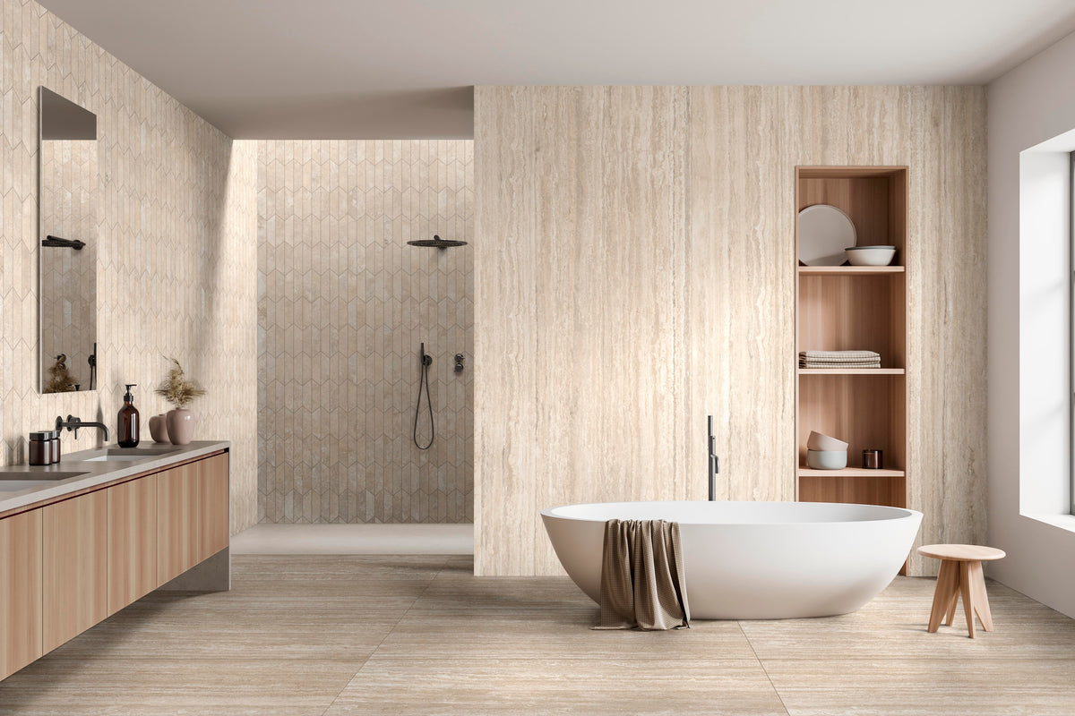 Minimal, soft-toned restroom scene featuring Travertine Veincut  24X48 Bianco Matte tile on both the wall and floor.