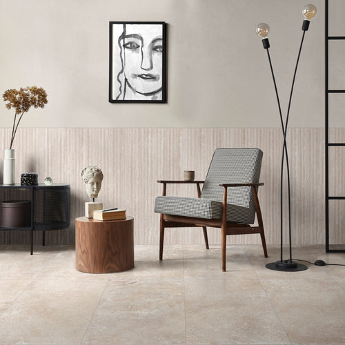Serene room arrangement with layered decor and a lamp, grounded by Travertine Veincut Canetto 3D 24X48 Bianco Matte tile
