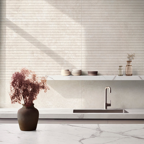 Clean kitchen arrangement with floral accents and subtle shadows across Travertine Veincut Dorica 3D Bianco Matte tile.