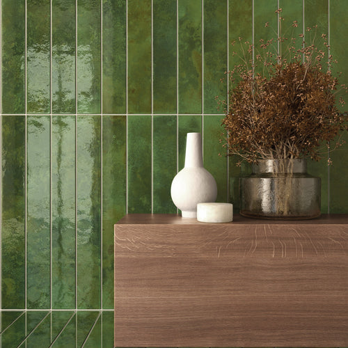 Bali Green 2x16 glossy ceramic tile on a feature wall and floor with deep green tones and reflective glaze