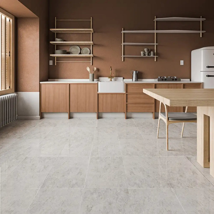 ElitTile Tile & Stone Collections: modern kitchen with light grey floor tiles, warm brown walls, and wood cabinetry.