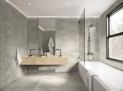 ElitTile Richmond LFT grey tiles cover this modern bathroom with a floating marble vanity, shower, and large window.