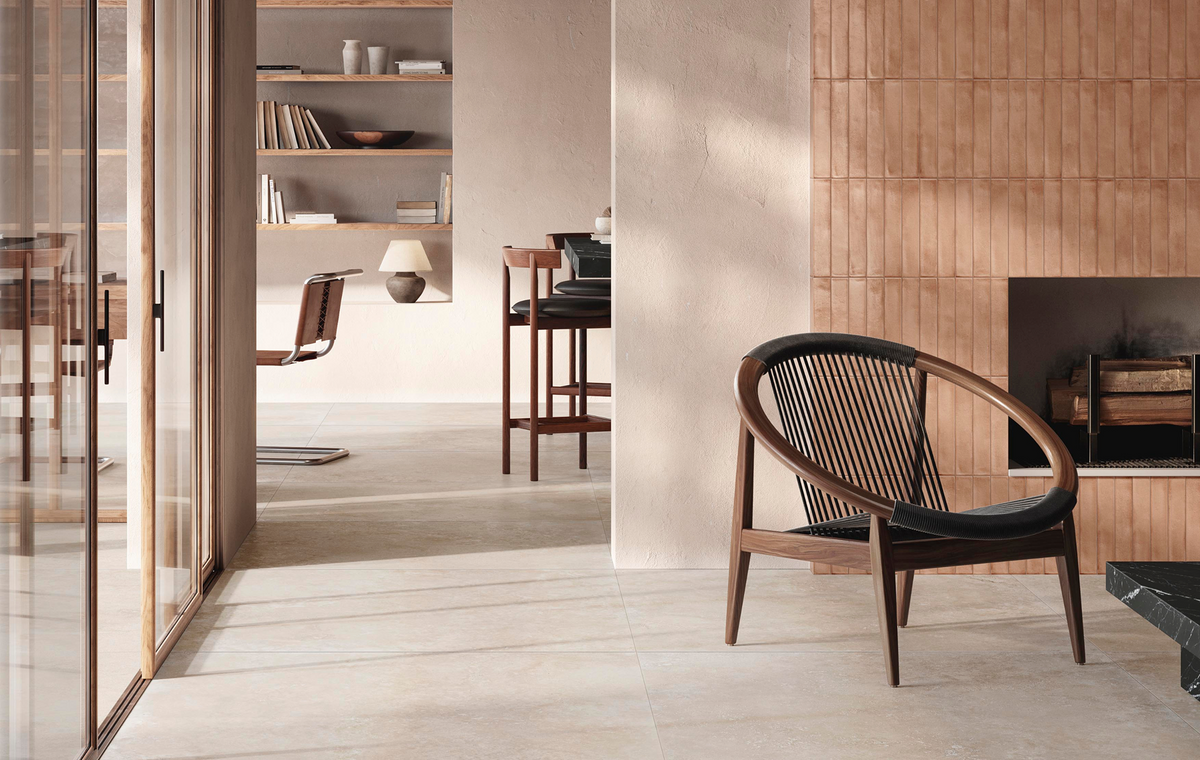 ElitTile Tile & Stone Collections showcase featuring light floor tiles, terracotta accent wall, and modern fireplace.